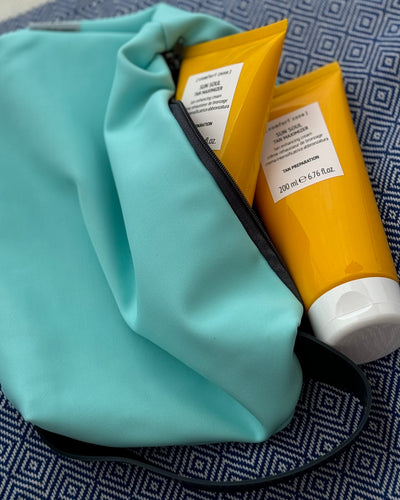 SOLKAMPAGNE - 2 Tan Maximizer samt en solcreme’s taske